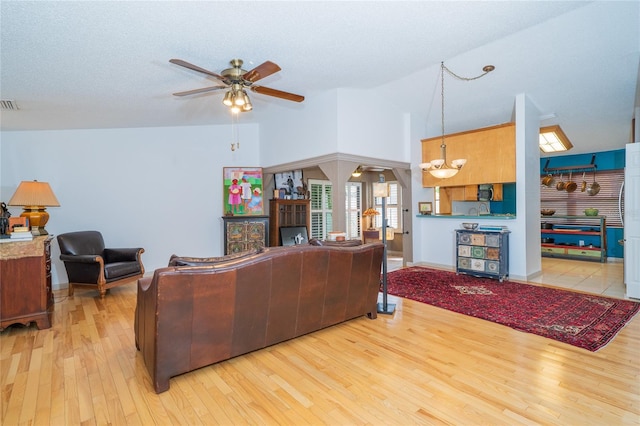4783 Palermo Ct NE, Saint Petersburg, FL 33703 - living room featuring a ceiling fan, hardwood / wood-style flooring, and high vaulted ceiling