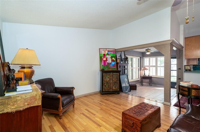 4783 Palermo Ct NE, Saint Petersburg, FL 33703 - living area featuring a ceiling fan, light wood-style floors, and baseboards