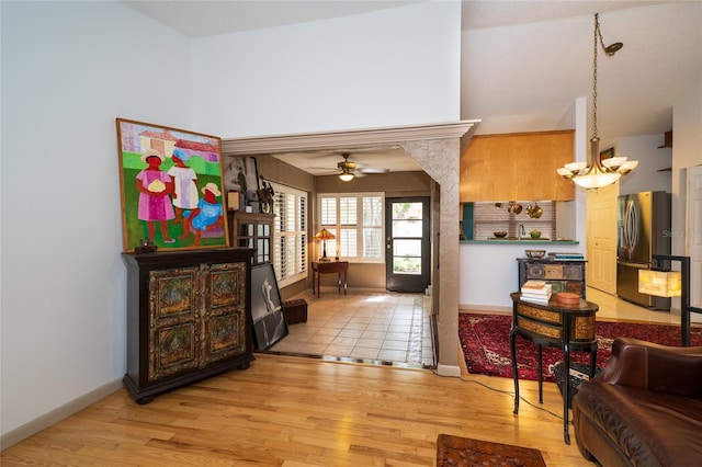 4783 Palermo Ct NE, Saint Petersburg, FL 33703 - entryway with light wood-style floors, ceiling fan, baseboards, and vaulted ceiling
