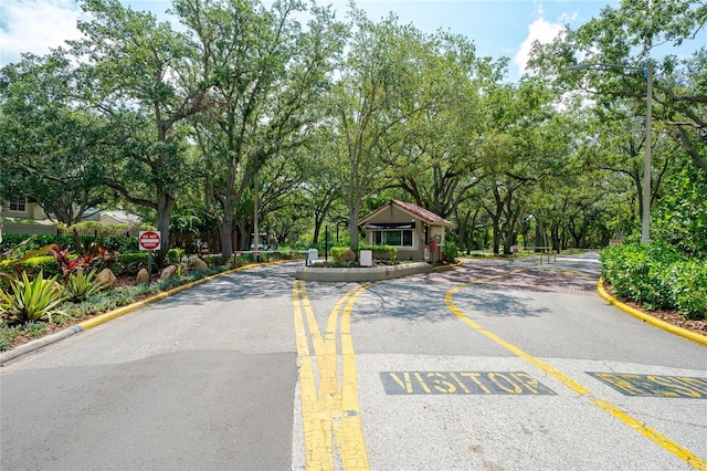 4783 Palermo Ct NE, Saint Petersburg, FL 33703 - view of asphalt street featuring curbs and traffic signs
