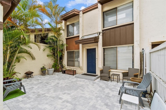1881 N Hercules Ave Unit 602, Clearwater, FL 33765 - back of house featuring a patio, stucco siding, and board and batten siding