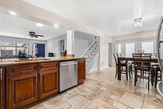 1881 N Hercules Ave Unit 602, Clearwater, FL 33765 - kitchen featuring stainless steel dishwasher, a sink, stone tile flooring, recessed lighting, and a ceiling fan