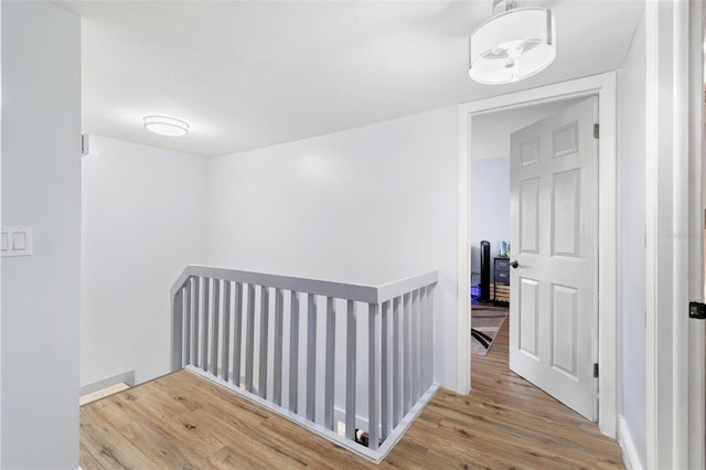 1881 N Hercules Ave Unit 602, Clearwater, FL 33765 - hall with an upstairs landing, wood finished floors, and baseboards