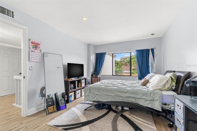 1881 N Hercules Ave Unit 602, Clearwater, FL 33765 - bedroom with light wood finished floors, baseboards, and recessed lighting