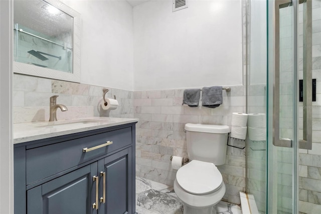 1881 N Hercules Ave Unit 602, Clearwater, FL 33765 - full bath featuring vanity, marble finish floors, a shower stall, toilet, and tile walls