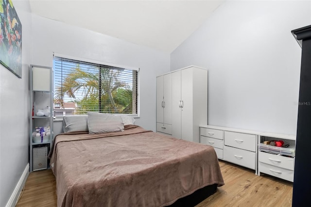 1881 N Hercules Ave Unit 602, Clearwater, FL 33765 - bedroom with light wood finished floors and high vaulted ceiling