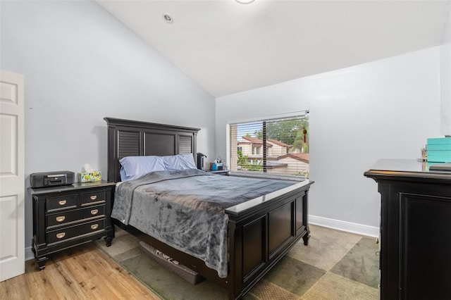 1881 N Hercules Ave Unit 602, Clearwater, FL 33765 - bedroom with high vaulted ceiling, light wood-style floors, and baseboards