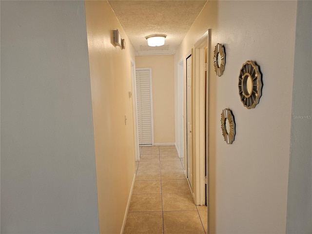 505 Innergary Pl, Valrico, FL 33594 - corridor with a textured ceiling and light tile patterned floors