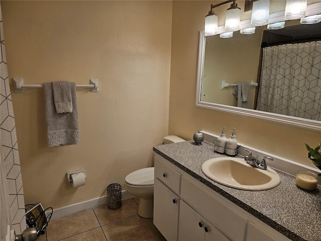 505 Innergary Pl, Valrico, FL 33594 - bathroom featuring tile patterned floors, toilet, vanity, and baseboards