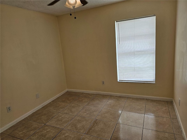 505 Innergary Pl, Valrico, FL 33594 - unfurnished room with a ceiling fan, tile patterned flooring, a textured ceiling, and baseboards
