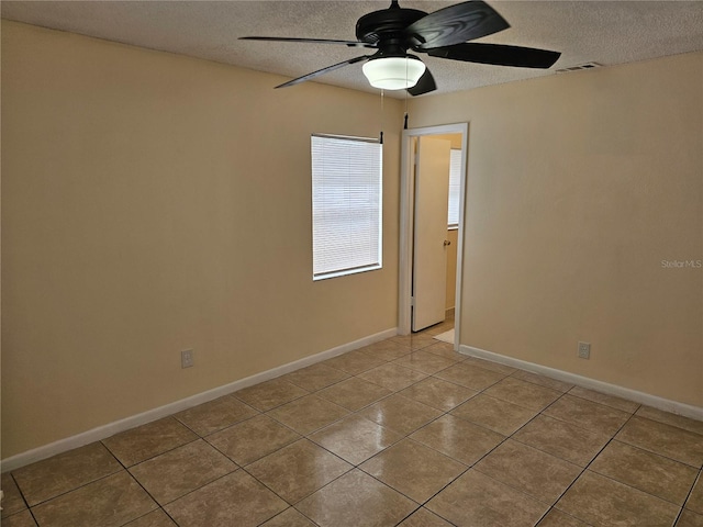 505 Innergary Pl, Valrico, FL 33594 - empty room featuring ceiling fan, a textured ceiling, tile patterned flooring, and baseboards