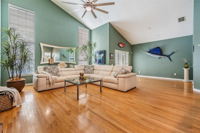 9806 Bennington Dr, Tampa, FL 33626 - living room featuring high vaulted ceiling, ceiling fan, hardwood / wood-style flooring, plenty of natural light, and baseboards