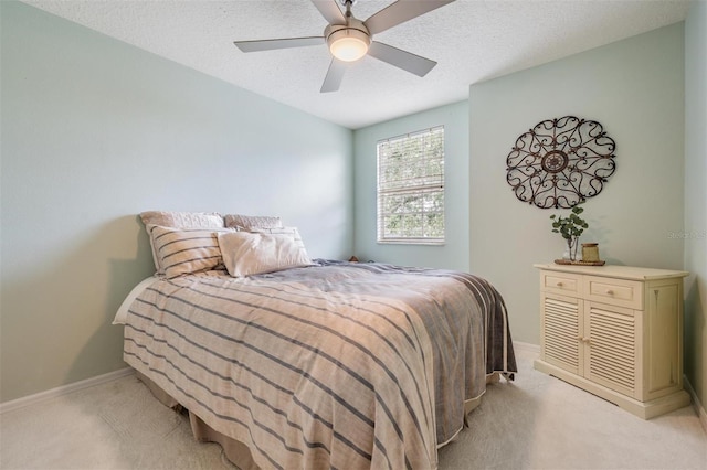 9806 Bennington Dr, Tampa, FL 33626 - bedroom with light carpet, a ceiling fan, baseboards, and a textured ceiling