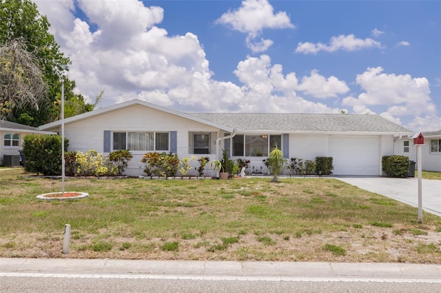 8014 Lotus Dr, Port Richey, FL 34668 - single story home with a garage, concrete driveway, and a front yard
