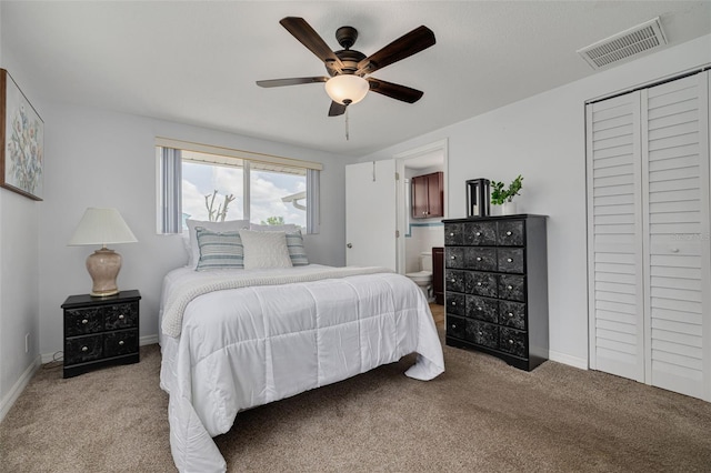 8014 Lotus Dr, Port Richey, FL 34668 - bedroom featuring carpet, a ceiling fan, ensuite bath, and a closet