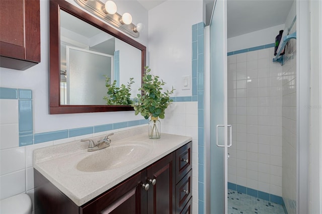 8014 Lotus Dr, Port Richey, FL 34668 - bathroom featuring tile walls, vanity, a shower stall, and wainscoting