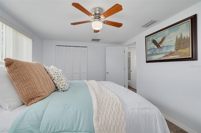 8014 Lotus Dr, Port Richey, FL 34668 - bedroom featuring a closet, a ceiling fan, and carpet