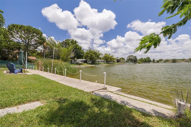 8014 Lotus Dr, Port Richey, FL 34668 - dock area with a yard and a water view