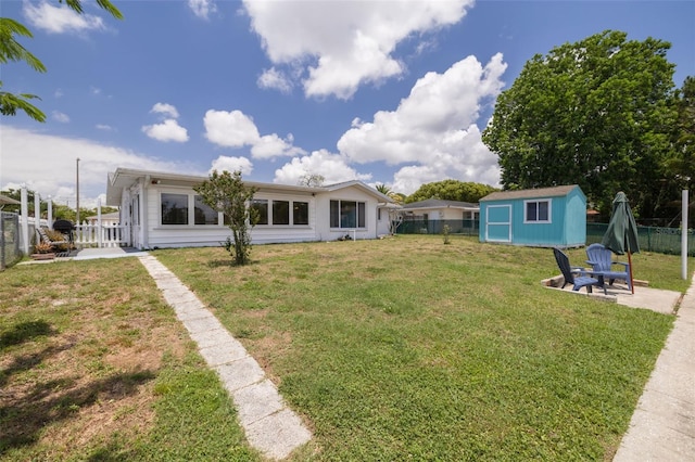 8014 Lotus Dr, Port Richey, FL 34668 - fenced backyard with a storage unit and a patio