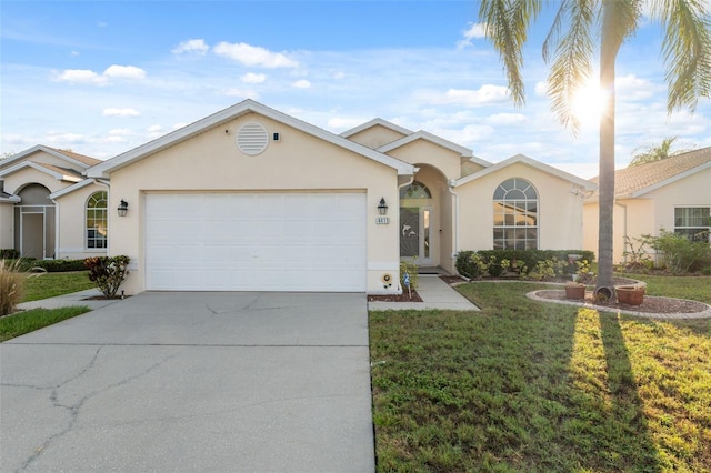 4411 Whitton Way, New Port Richey, FL 34653 - ranch-style home with stucco siding, driveway, and an attached garage