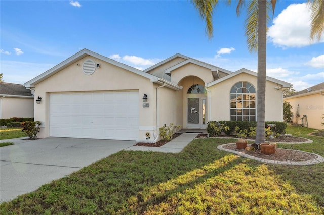 4411 Whitton Way, New Port Richey, FL 34653 - single story home with stucco siding, a garage, driveway, and a front lawn