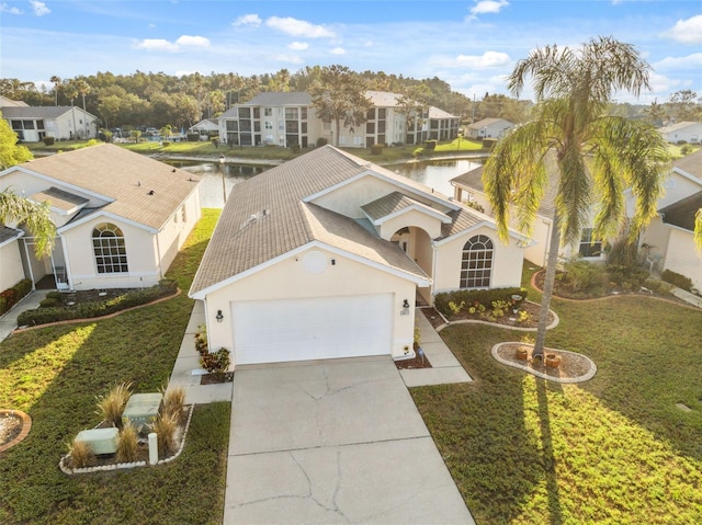 4411 Whitton Way, New Port Richey, FL 34653 - mediterranean / spanish-style home with a water view, a residential view, and stucco siding