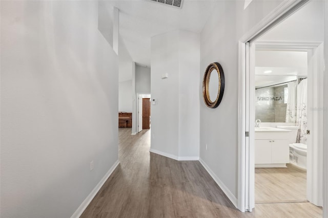 4411 Whitton Way, New Port Richey, FL 34653 - hall with wood finished floors and baseboards