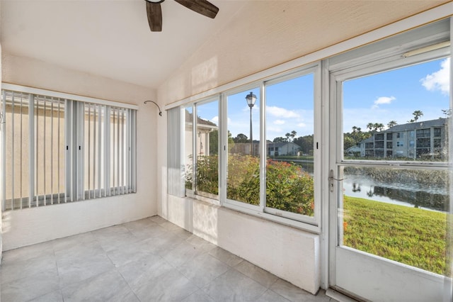 4411 Whitton Way, New Port Richey, FL 34653 - unfurnished sunroom featuring lofted ceiling and a water view