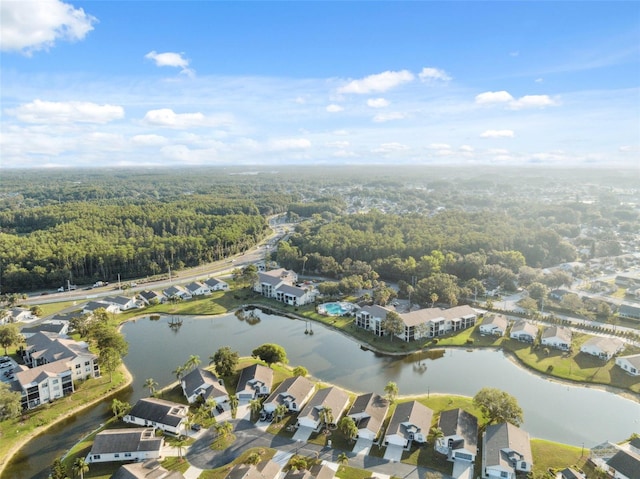 4411 Whitton Way, New Port Richey, FL 34653 - aerial perspective of suburban area featuring a forest and a large body of water