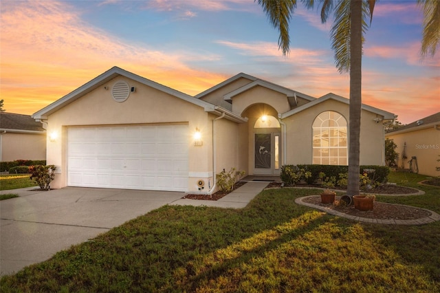 4411 Whitton Way, New Port Richey, FL 34653 - ranch-style home featuring stucco siding, an attached garage, driveway, and a yard