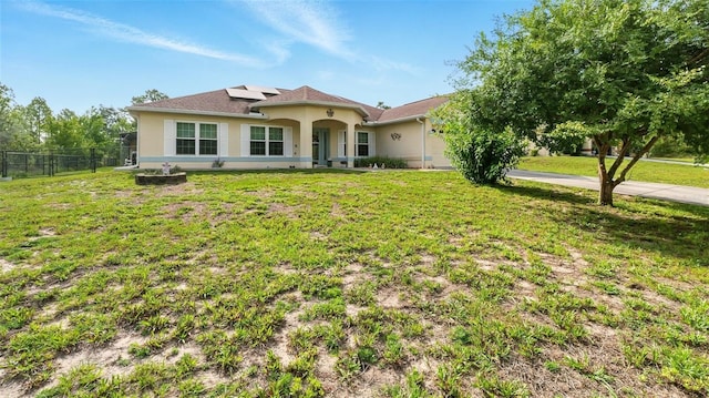 15348 Glossy Ibis Rd, Weeki Wachee, FL 34614 - mediterranean / spanish-style house featuring stucco siding, solar panels, concrete driveway, and an attached garage