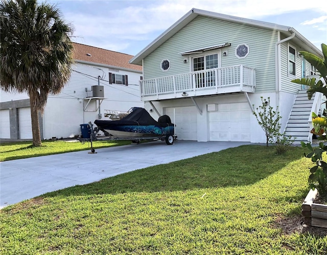 3312 Holly Springs Dr, Hernando Beach, FL 34607 - view of front of house with driveway, an attached garage, a front lawn, and stairway