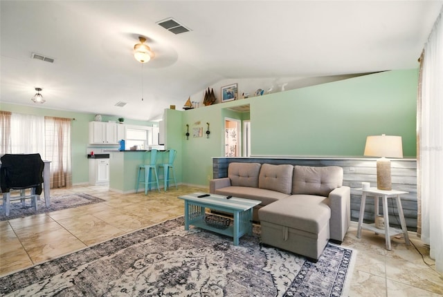 3312 Holly Springs Dr, Hernando Beach, FL 34607 - living room with lofted ceiling, light marble finish floors, and a ceiling fan