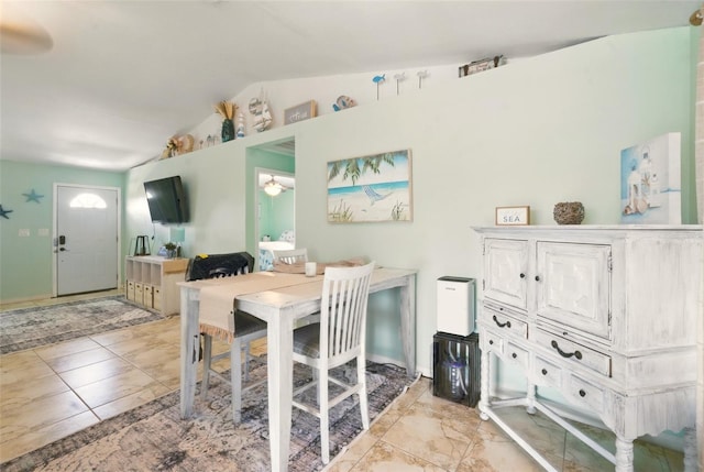 3312 Holly Springs Dr, Hernando Beach, FL 34607 - dining room with vaulted ceiling and a ceiling fan