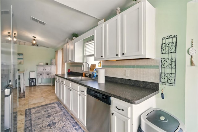 3312 Holly Springs Dr, Hernando Beach, FL 34607 - kitchen featuring stainless steel dishwasher, a sink, dark countertops, backsplash, and white cabinetry