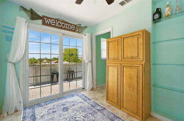 3312 Holly Springs Dr, Hernando Beach, FL 34607 - entryway with light marble finish floors and ceiling fan