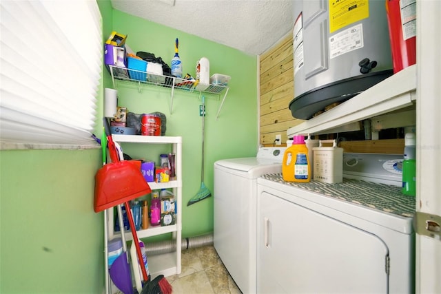3312 Holly Springs Dr, Hernando Beach, FL 34607 - laundry room with independent washer and dryer, water heater, a textured ceiling, and light tile patterned floors