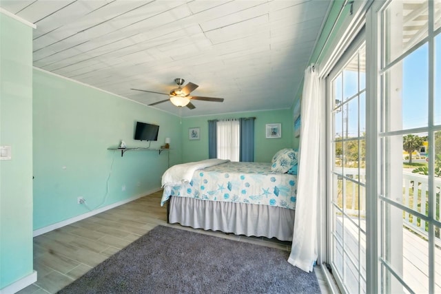 3312 Holly Springs Dr, Hernando Beach, FL 34607 - bedroom featuring ornamental molding, baseboards, a ceiling fan, and wood finished floors