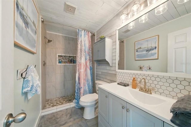 3312 Holly Springs Dr, Hernando Beach, FL 34607 - bathroom with toilet, vanity, tiled shower, decorative backsplash, and ornamental molding