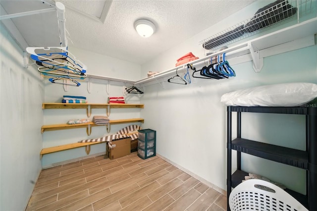 3312 Holly Springs Dr, Hernando Beach, FL 34607 - walk in closet featuring wood finished floors