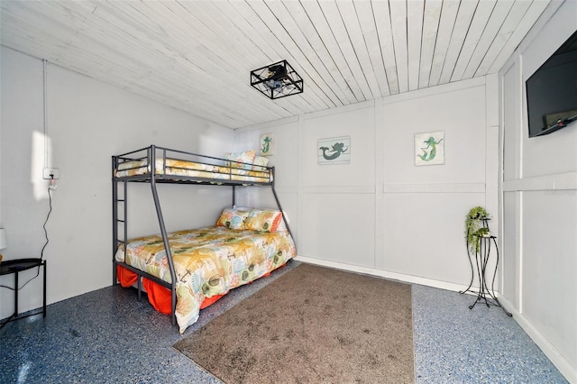 3312 Holly Springs Dr, Hernando Beach, FL 34607 - bedroom featuring speckled floor and wood ceiling