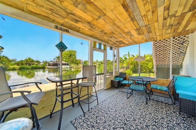 3312 Holly Springs Dr, Hernando Beach, FL 34607 - sunroom / solarium with a water view