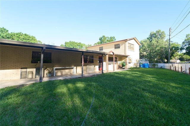 18121 Geraci Rd, Lutz, FL 33548 - rear view of house featuring brick siding and an exterior structure