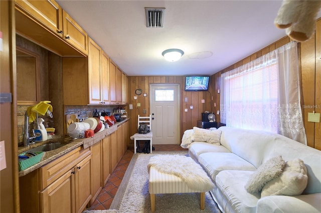 18121 Geraci Rd, Lutz, FL 33548 - tiled living room featuring wood walls