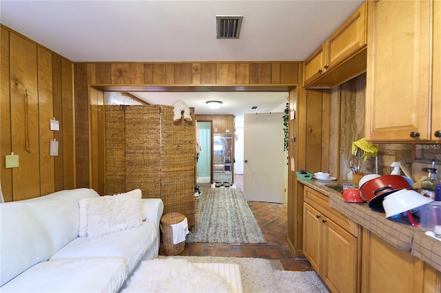 18121 Geraci Rd, Lutz, FL 33548 - living room with brick floors and wood walls