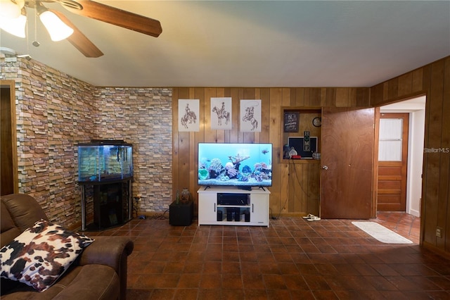 18121 Geraci Rd, Lutz, FL 33548 - living room with a fireplace, a ceiling fan, and wood walls
