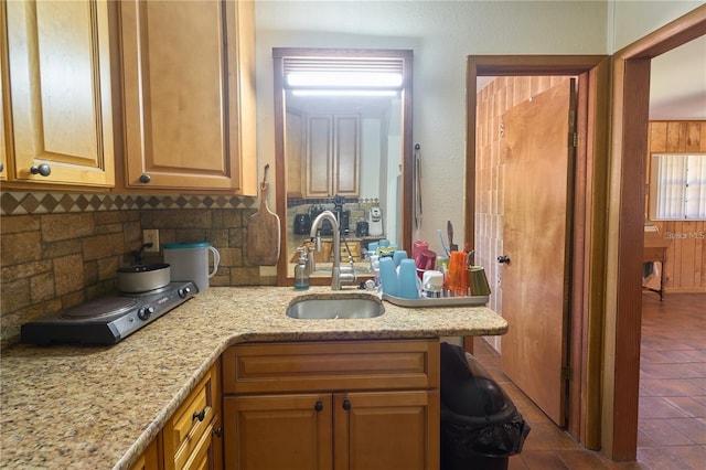 18121 Geraci Rd, Lutz, FL 33548 - kitchen with tasteful backsplash, a sink, light stone counters, and tile patterned flooring