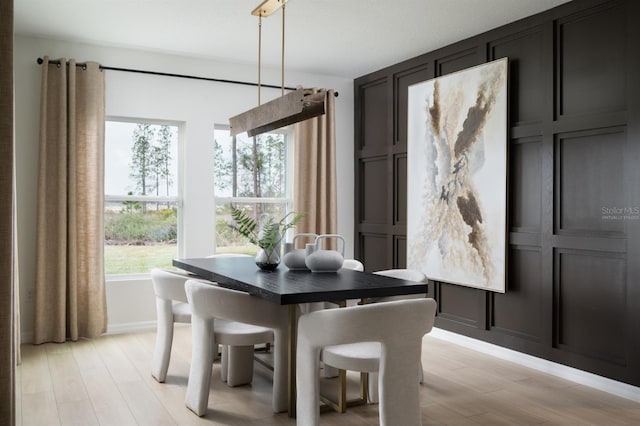 1233 Tidal St, Haines City, FL 33844 - dining space featuring light wood-style flooring and baseboards