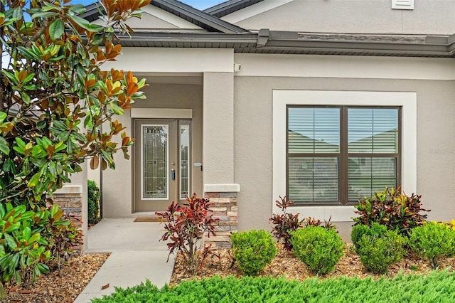18620 Rococo Rd, Spring Hill, FL 34610 - view of exterior entry featuring stucco siding