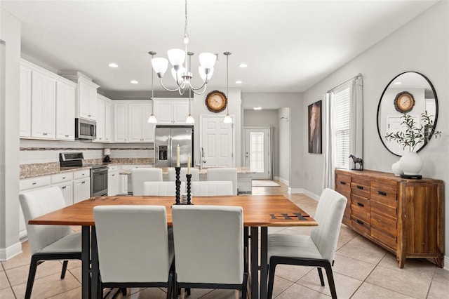 18620 Rococo Rd, Spring Hill, FL 34610 - dining space featuring light tile patterned floors, a chandelier, recessed lighting, and baseboards